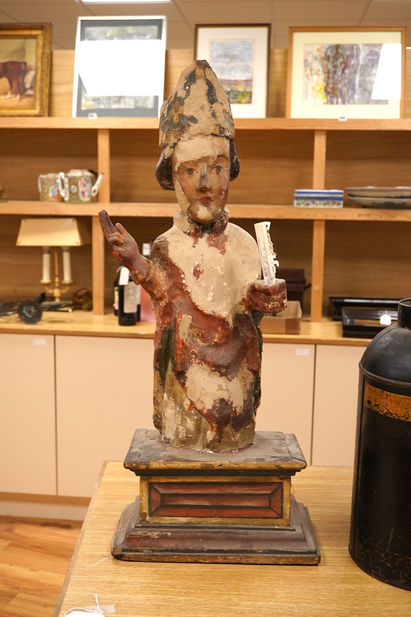 A 19th century and later Continental polychrome wood figure of a bishop, 77cm